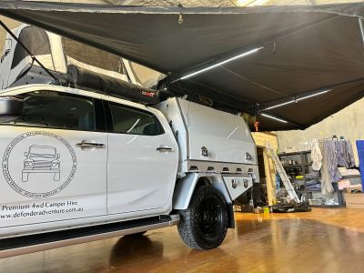 Defender Adventure Family Plus Camper 270-degree-awning open